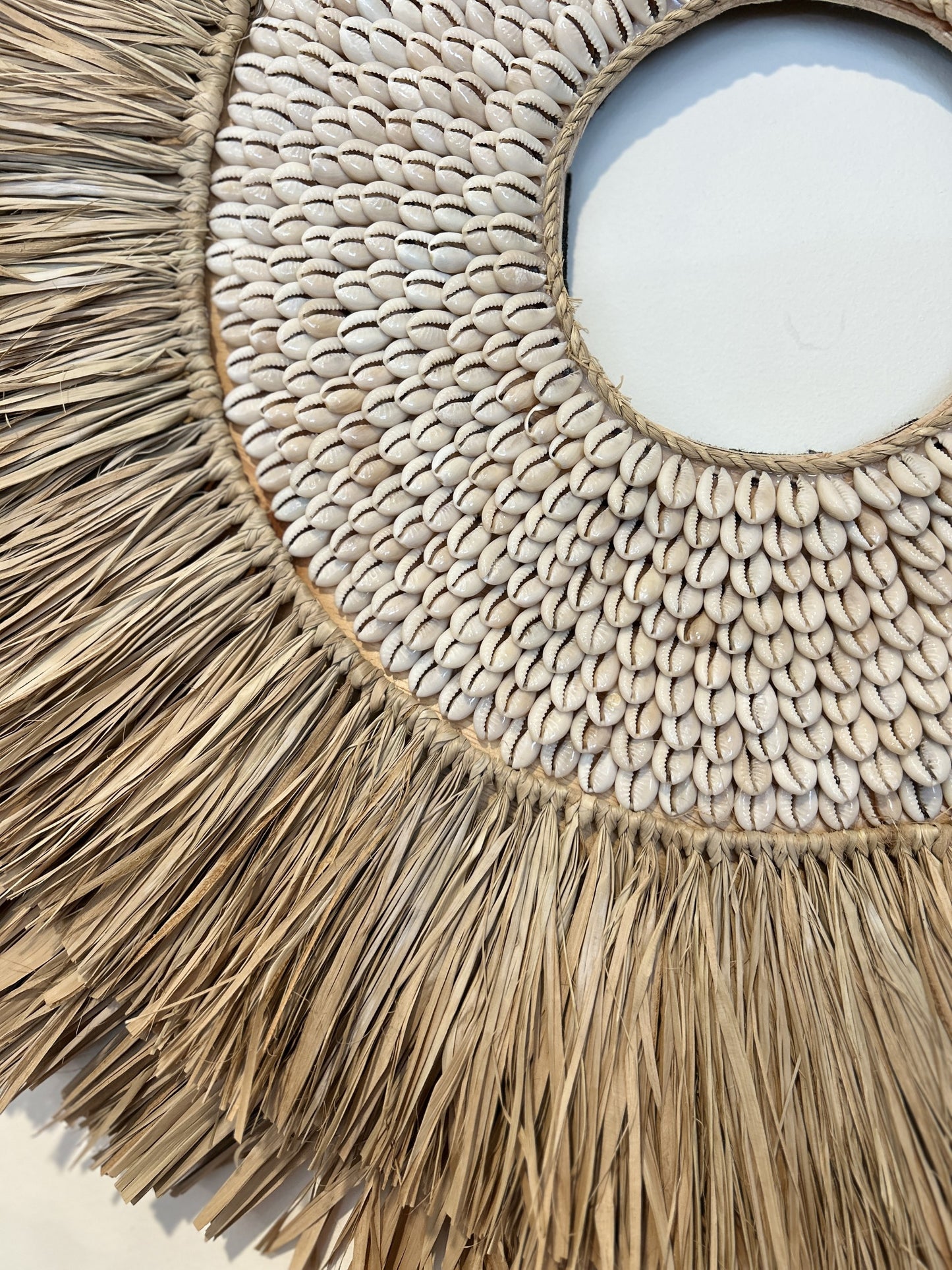Shell and raffia wall art