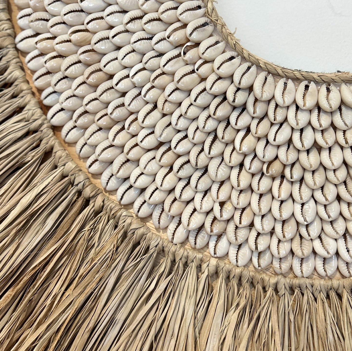Shell and raffia wall art