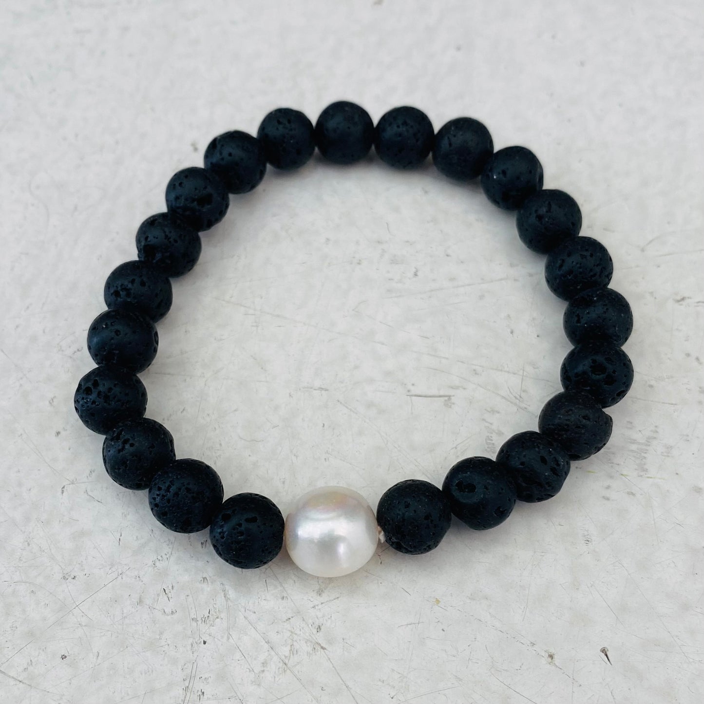 Lava stone bracelet with single large pearl