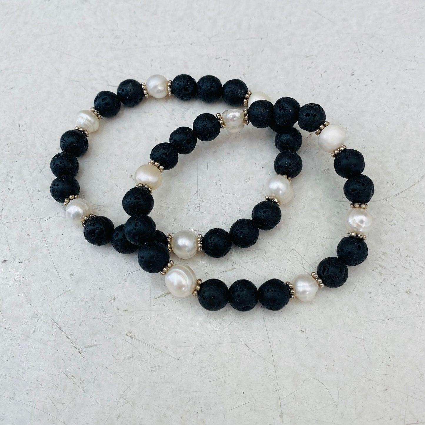 Lava stone beaded bracelet with small pearls