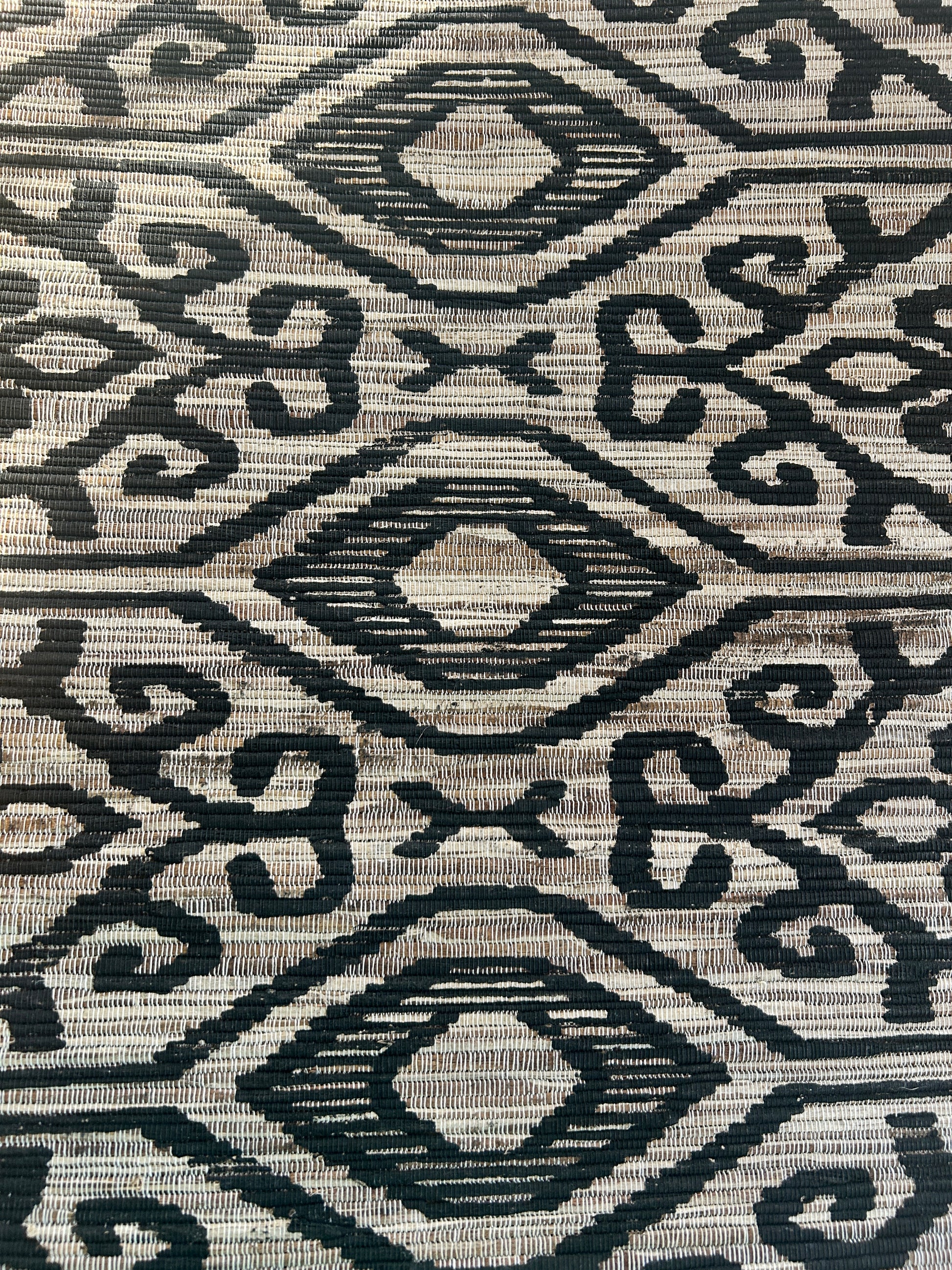 Ikat table runner with black and natural pattern