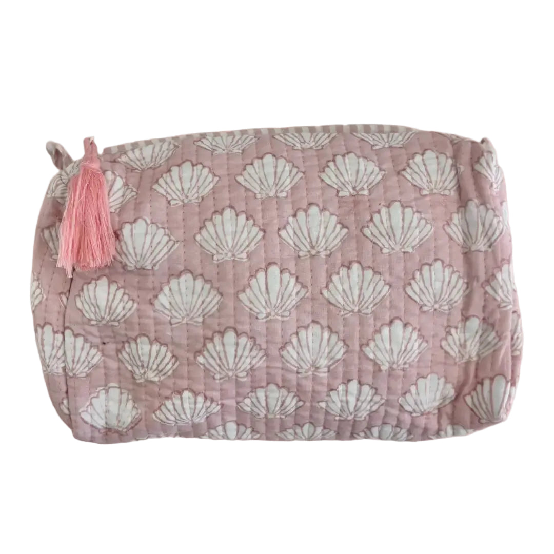 Close up of baby pink shell print handmade block printed cosmetic bag
