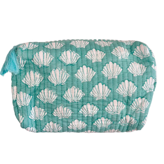Turquoise block printed  with white shell pattern on a  white background