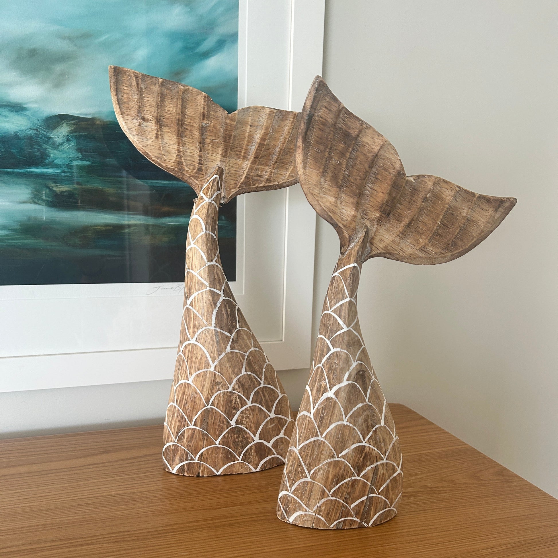 Wooden mermaid tail decorations.  Set of 2 on a wooden cabinet. Coastal luxe
